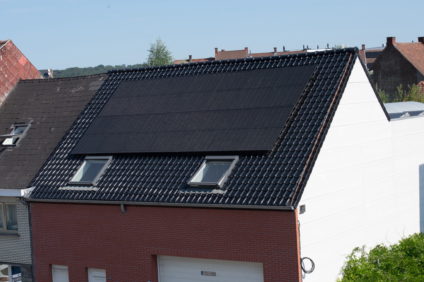 Black glazed tiled roof with an all-black solar array