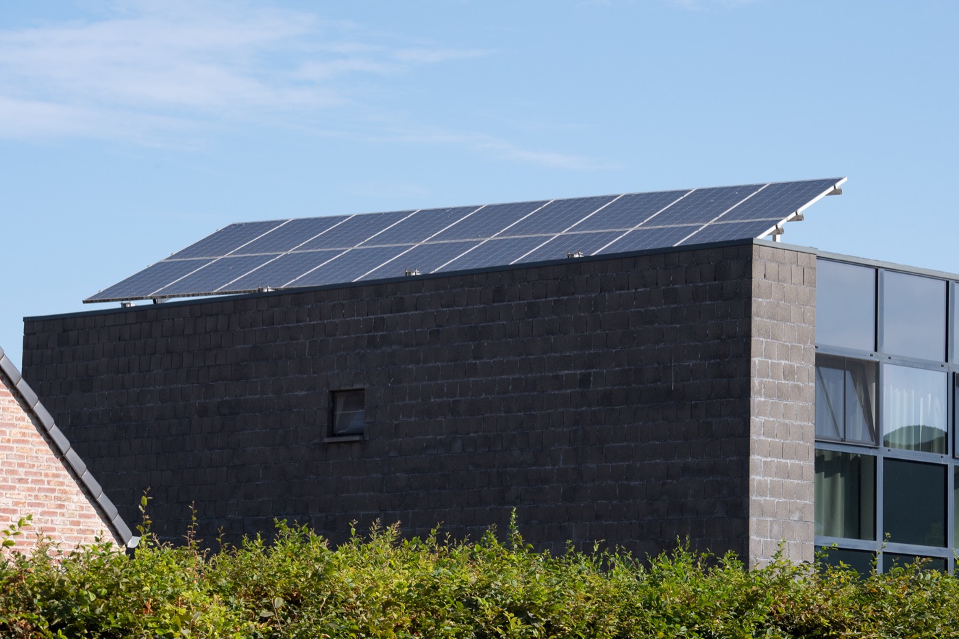 Solar panels on a commercial building with slate cladding