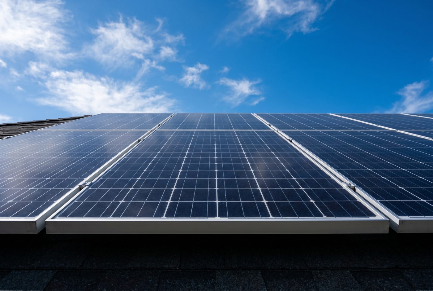 Close-up of solar panels against a blue sky